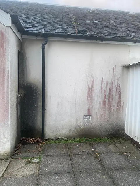 Clubhouse rear wall before cleaning