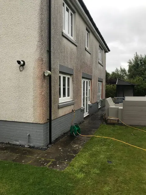 Rear of a rendered family home in East Kilbride before cleaning