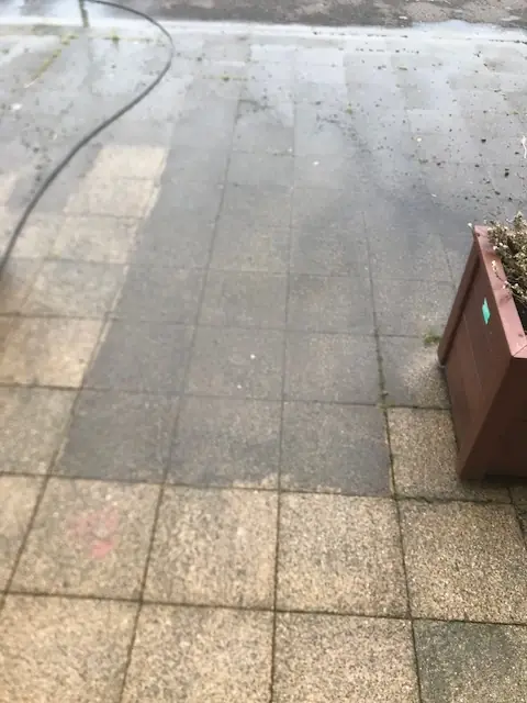 The line between cleaned and uncleaned paving